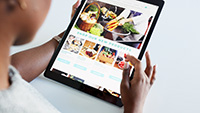 Toms River website designer; customer using tablet