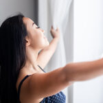 Person enjoying clean indoor air after duct cleaning in Ocean County